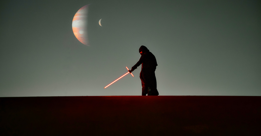 Jedi with a lightsaber in the desert
